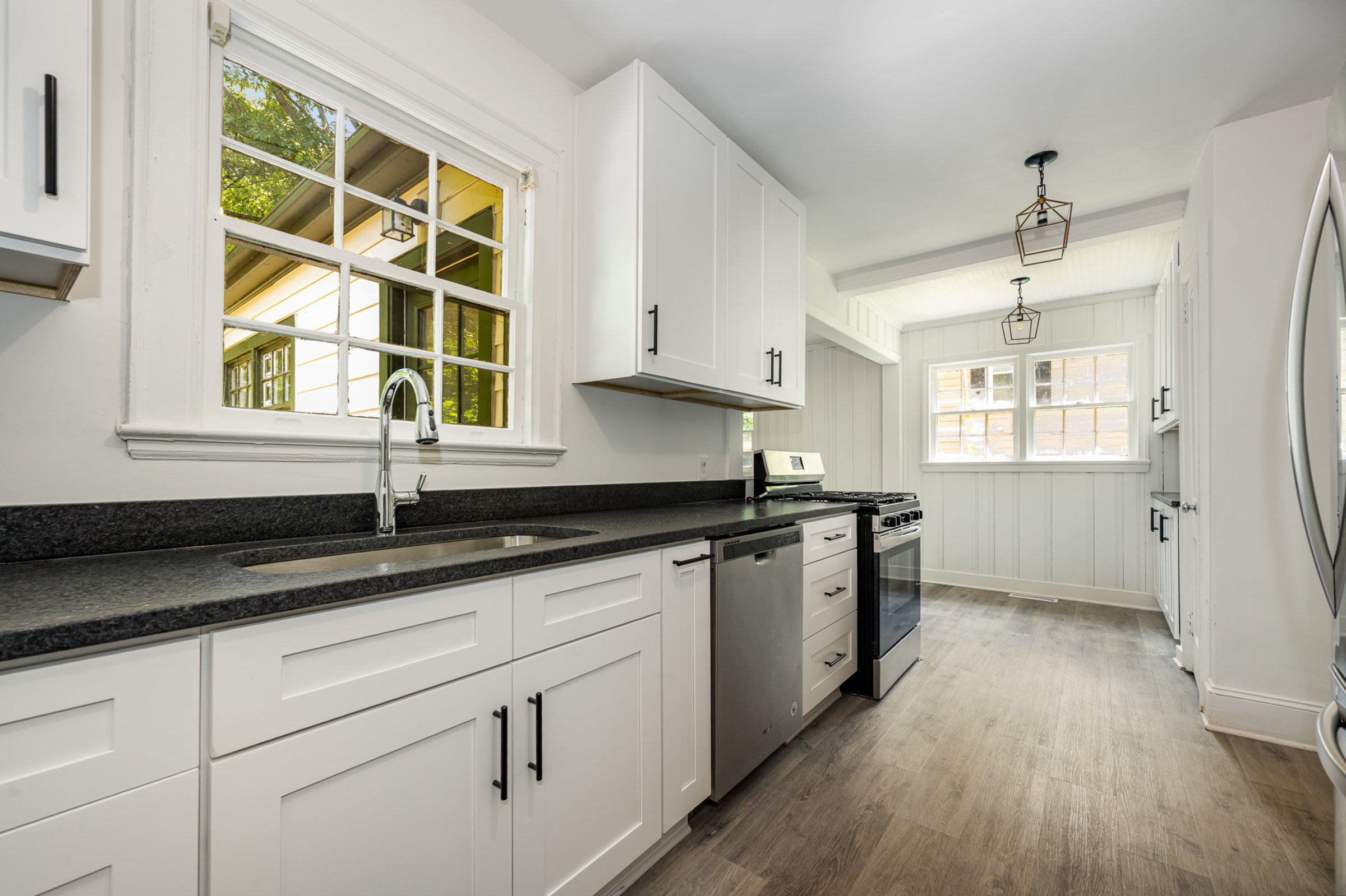 Brand new kitchen includes new cabinets and appliances.